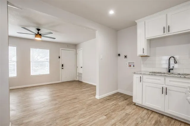 a view of a kitchen with electric appliances