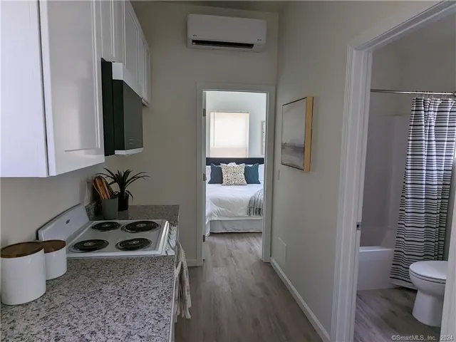 a kitchen with a stove a sink and a refrigerator