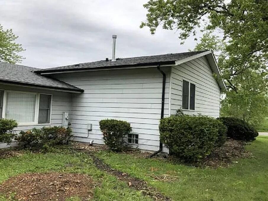 5631 Colgate Lane Matteson, IL 60443 - Photo 8 of 8 a view of a backyard with plants and a large tree