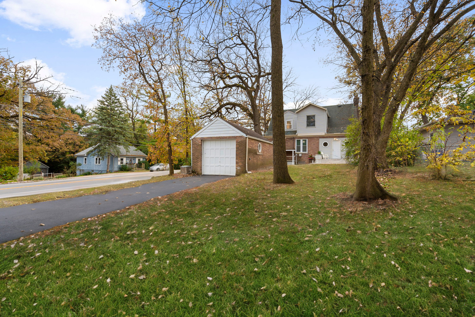 1600 Pine Road Homewood, IL 60430 - Photo 26 of 28 a view of road with large trees