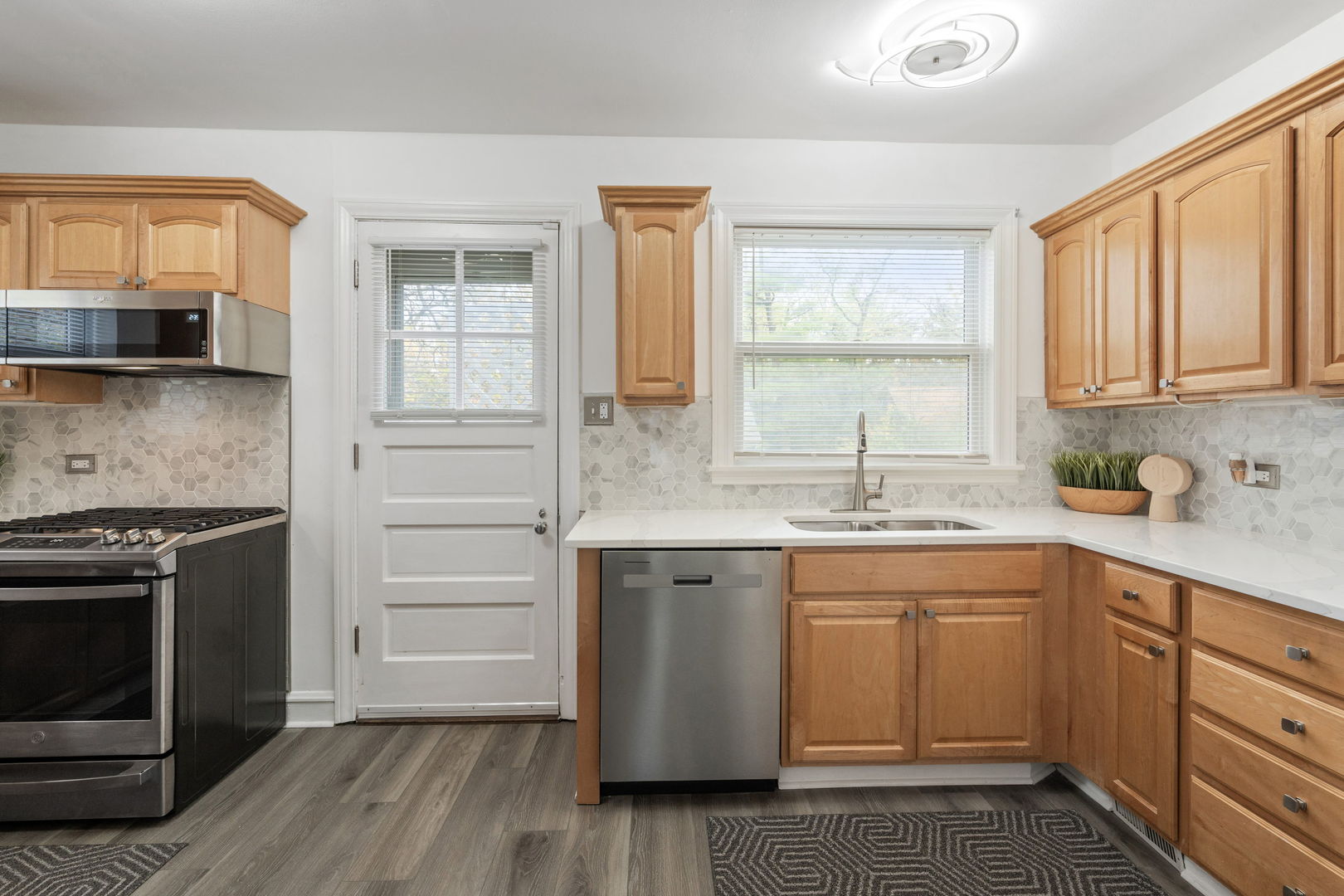 1600 Pine Road Homewood, IL 60430 - Photo 9 of 28 a kitchen with a stove sink and cabinets