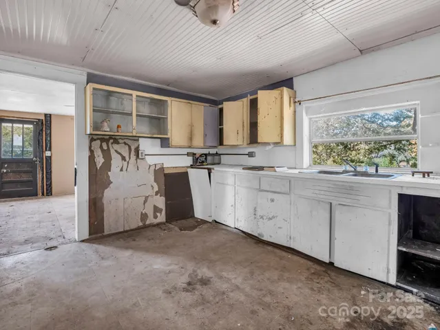 wooden floor and a bathroom with mirror
