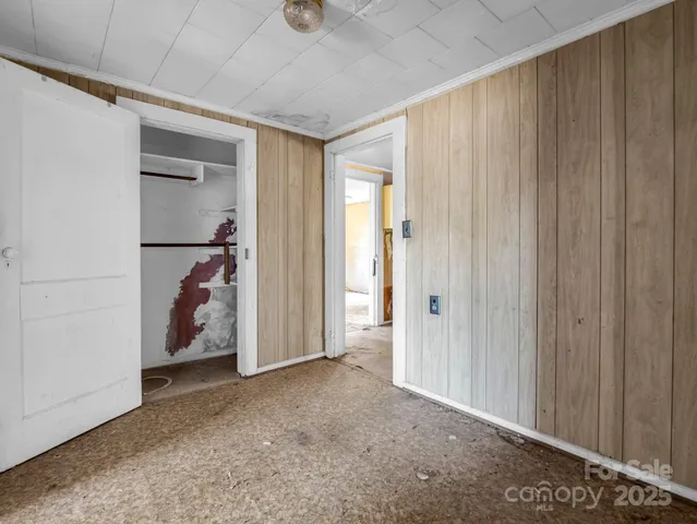 a utility room with cabinets washer and dryer