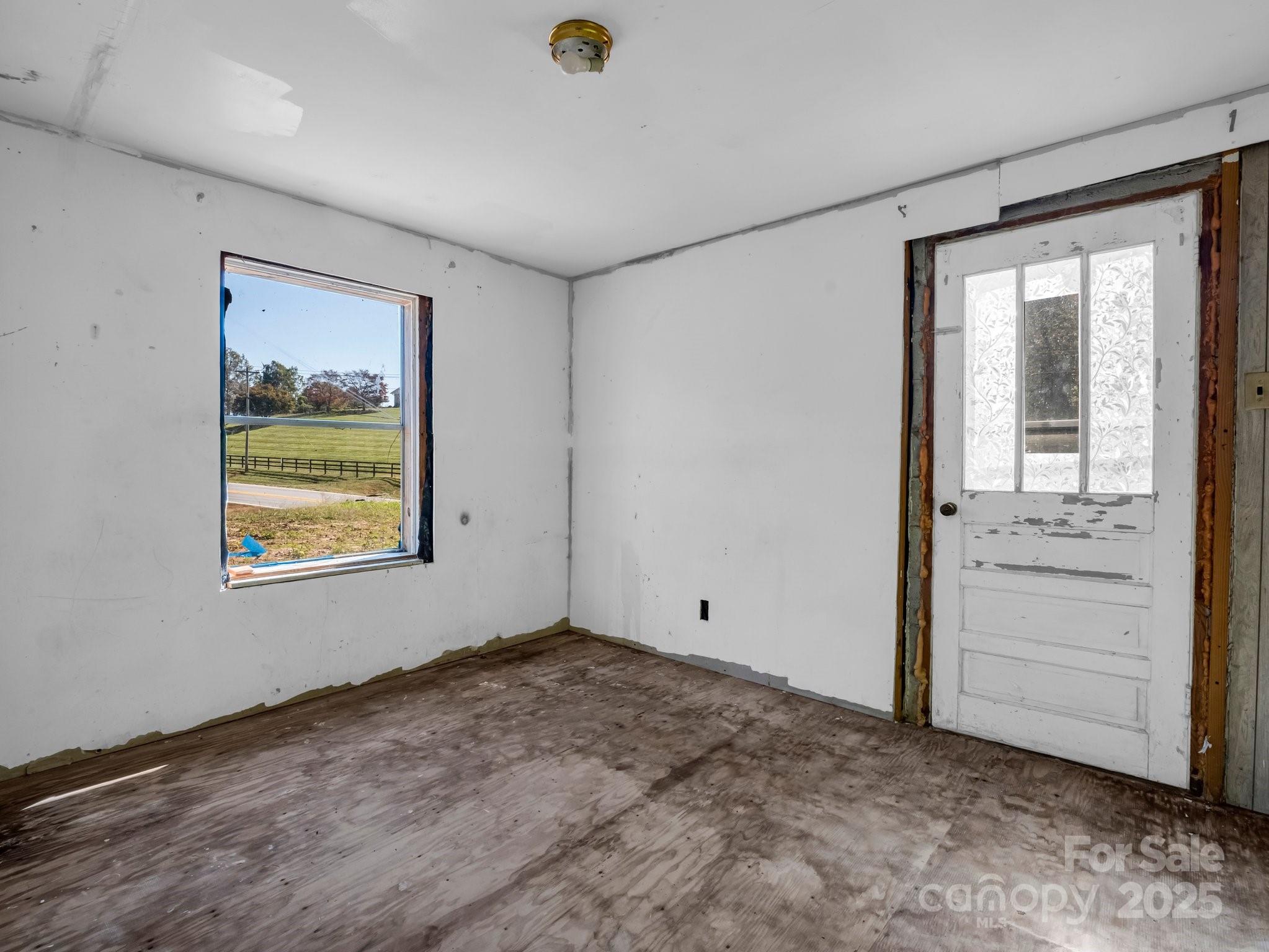 6271 Highway 108 Mill Spring, NC 28756 - Photo 18 of 35 a view of room with window and ceiling fan