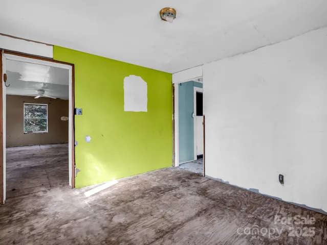 a view of a door with wooden floor