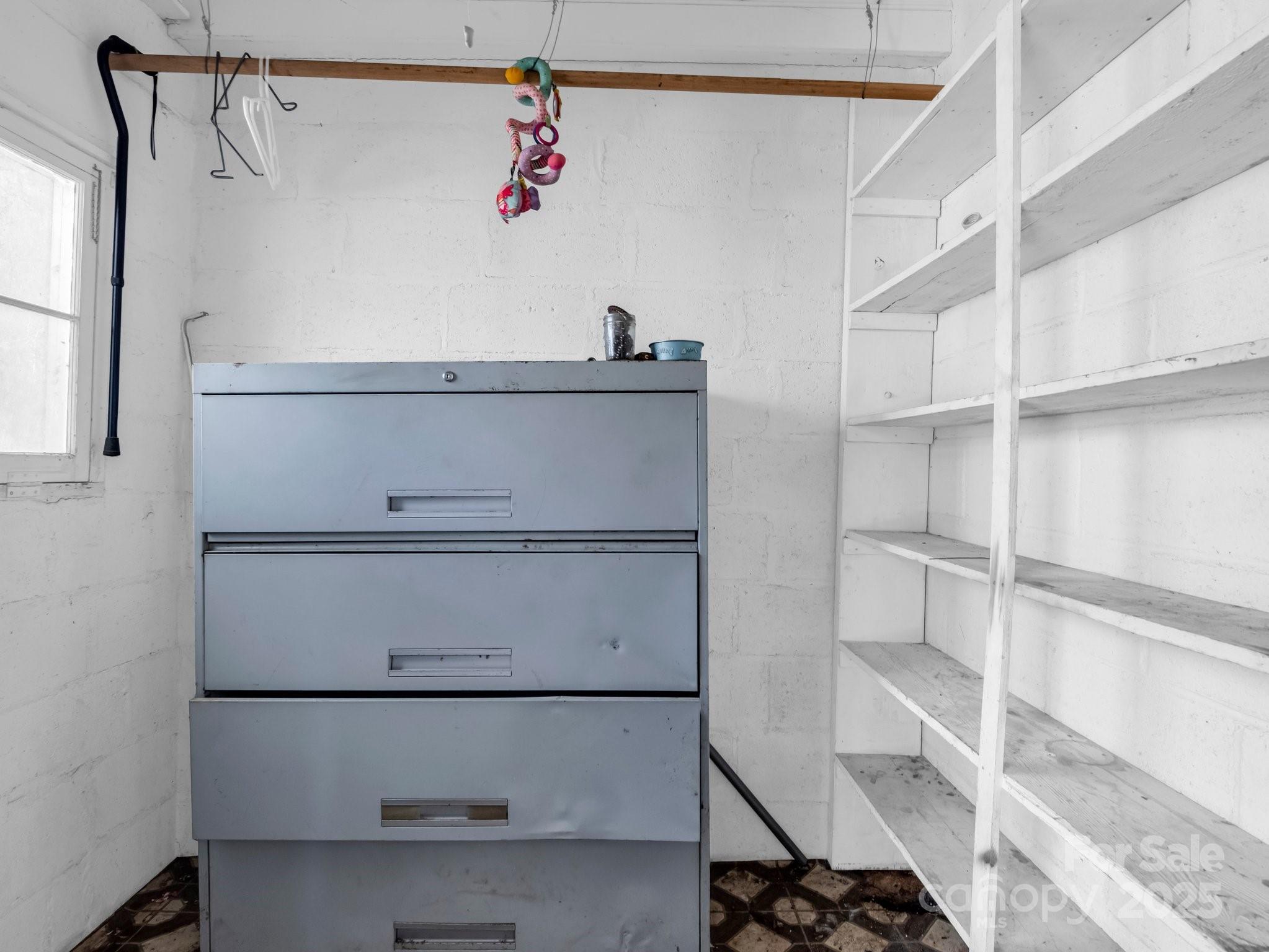 6271 Highway 108 Mill Spring, NC 28756 - Photo 21 of 35 a view of walk in closet with empty racks
