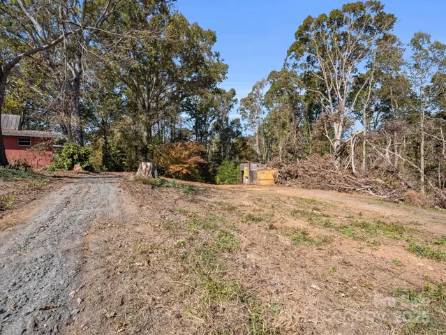 a pathway of a house with a yard