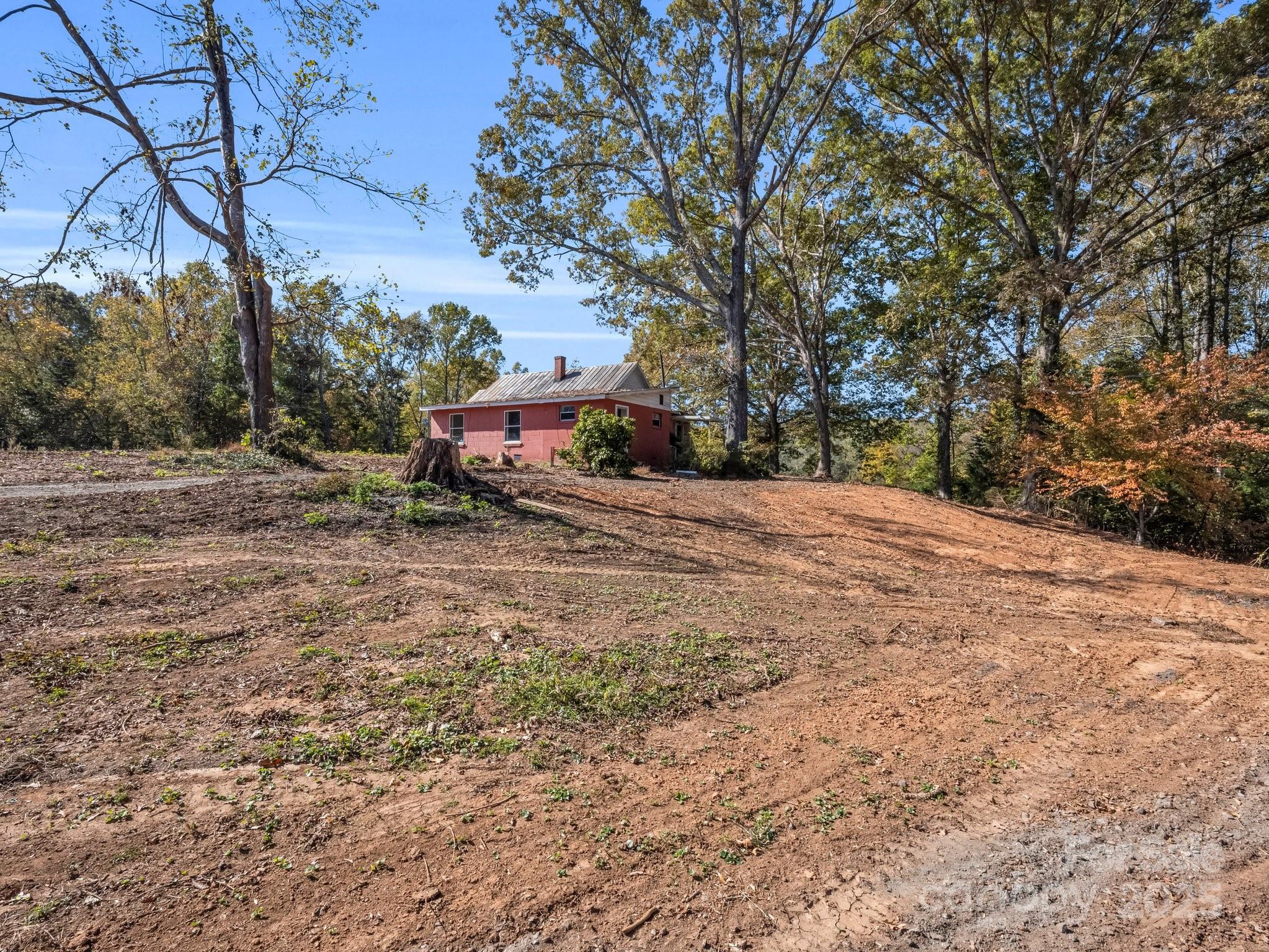 6271 Highway 108 Mill Spring, NC 28756 - Photo 25 of 35 a pathway of a house with a yard