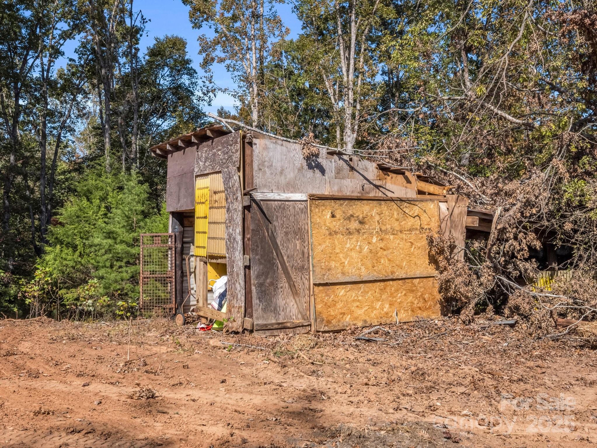 6271 Highway 108 Mill Spring, NC 28756 - Photo 26 of 35 a view of a wooden house with large trees