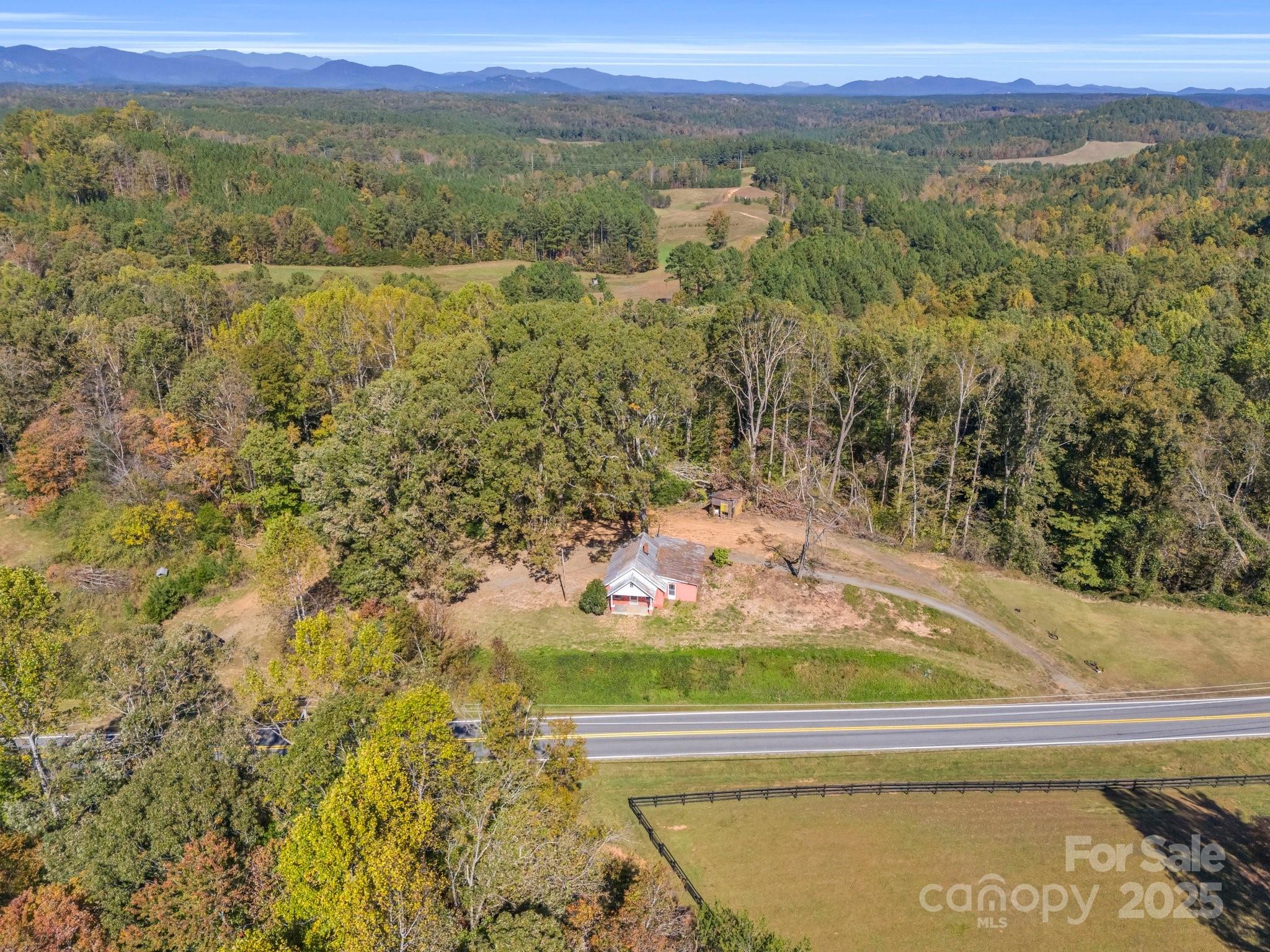 6271 Highway 108 Mill Spring, NC 28756 - Photo 29 of 35 a view of a lake with a mountain in the background
