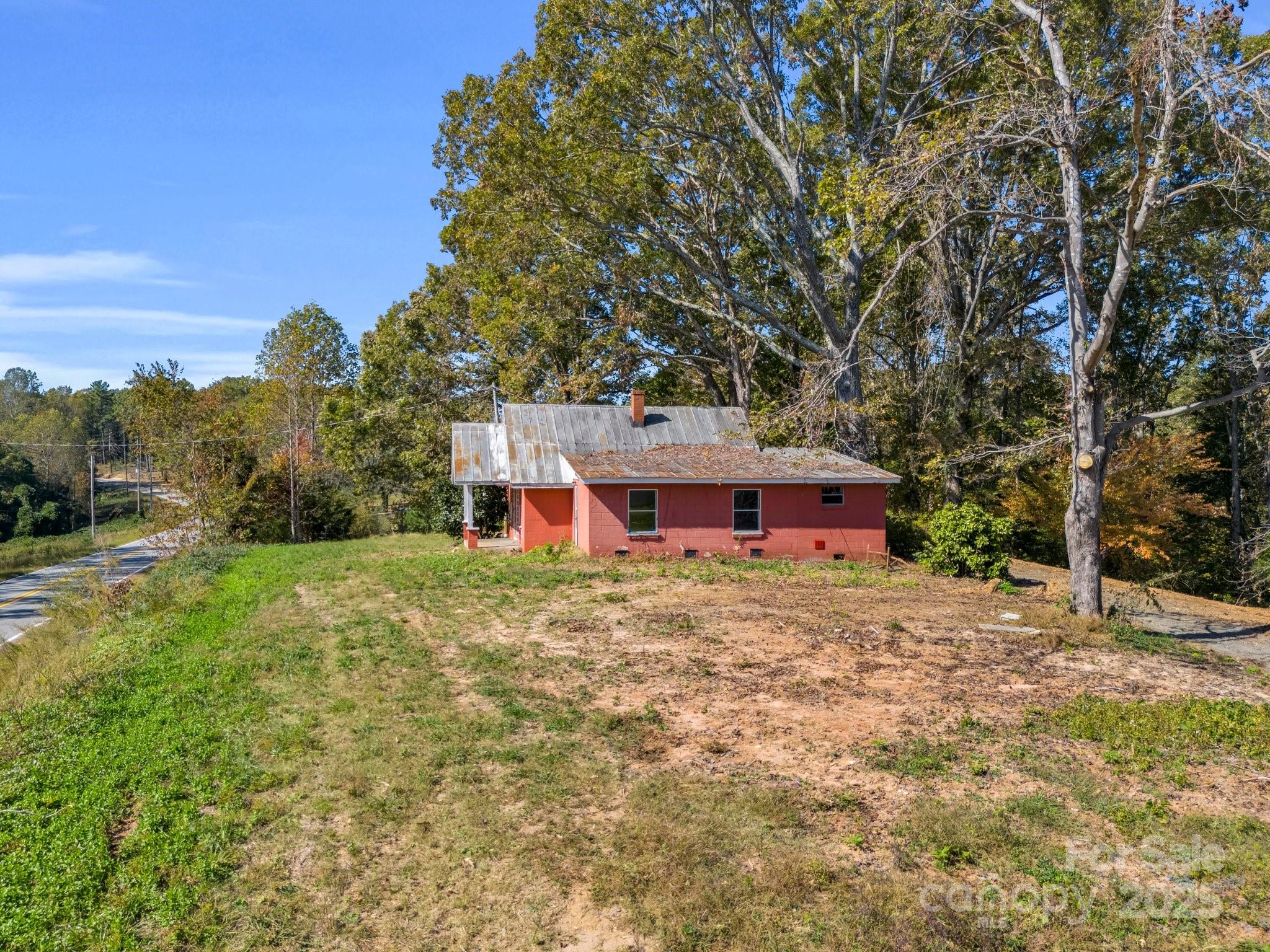 6271 Highway 108 Mill Spring, NC 28756 - Photo 35 of 35 a view of a house with a yard