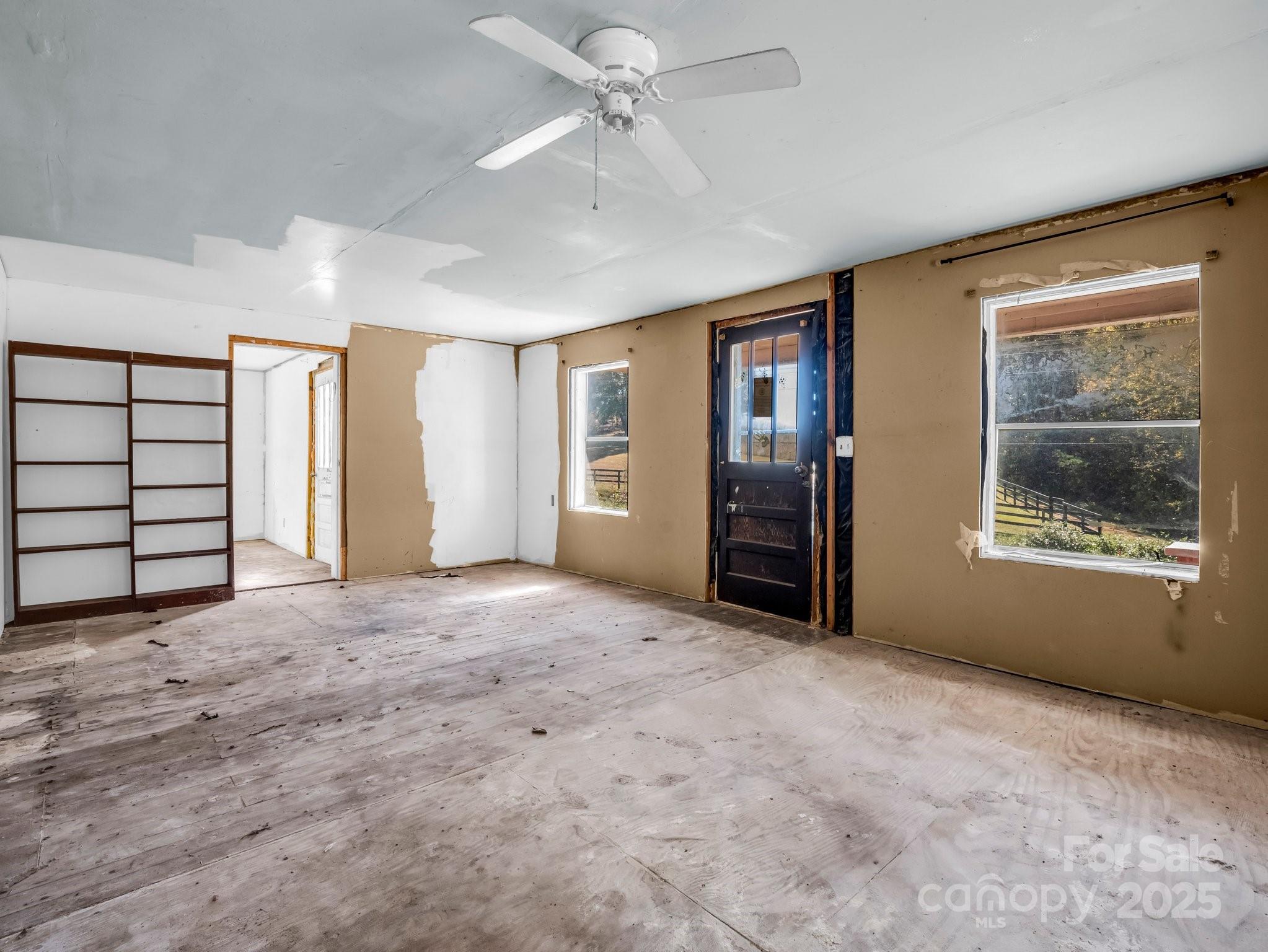 6271 Highway 108 Mill Spring, NC 28756 - Photo 7 of 35 an empty room with closet and windows