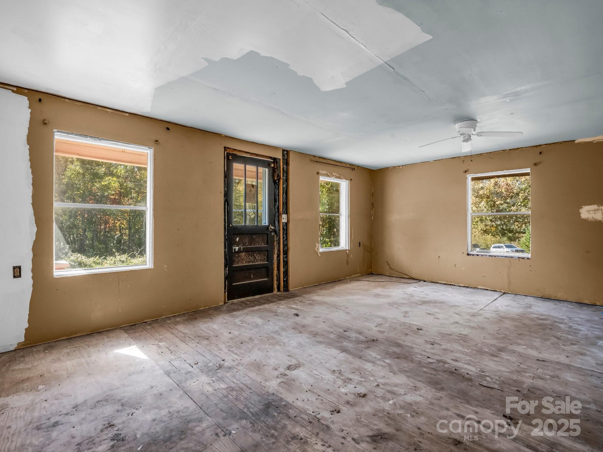 6271 Highway 108 Mill Spring, NC 28756 - Photo 8 of 35 an empty room with windows and closet