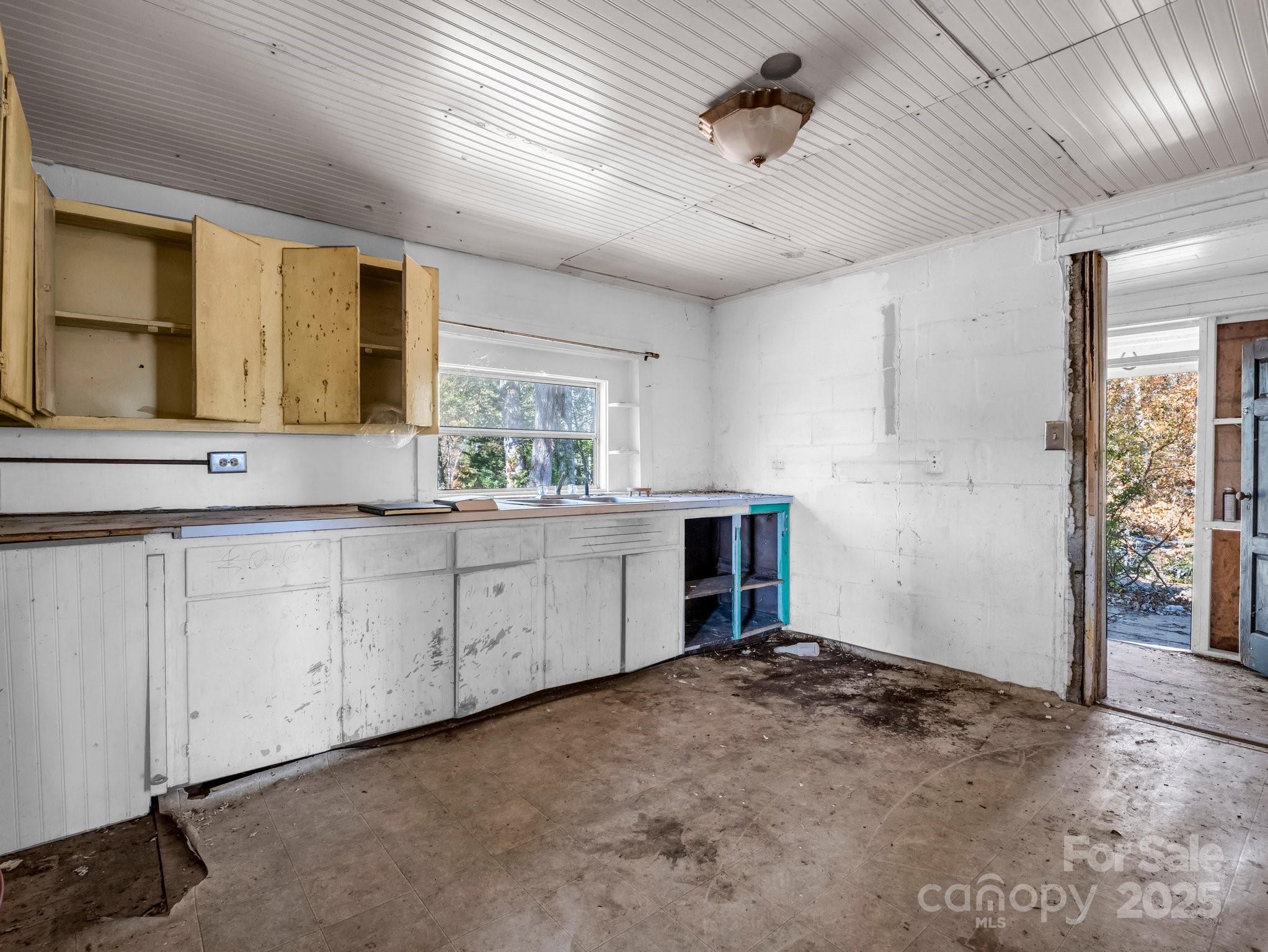 6271 Highway 108 Mill Spring, NC 28756 - Photo 10 of 35 a kitchen with white cabinets
