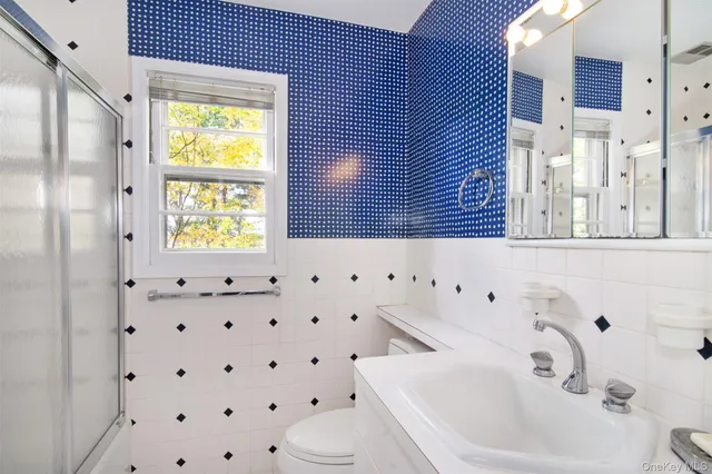 a bathroom with a sink a toilet and a bathtub