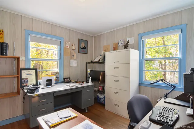 a kitchen with a refrigerator table and chairs