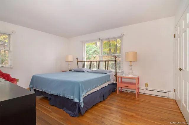 a bedroom with a bed and a table