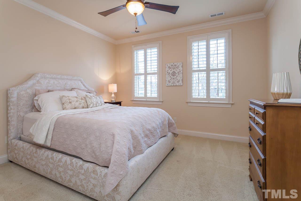 821 Keith Road Wake Forest, NC 27587 - Photo 13 of 25 Additional features include planation shutters, crown molding, ceiling fan, and a large double door closet.