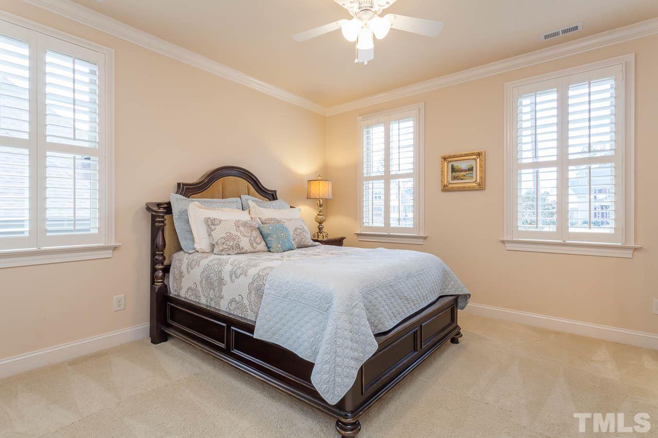 821 Keith Road Wake Forest, NC 27587 - Photo 15 of 25 Additional features included a ceiling fan, plantation shutters, crown molding and a double door closet.