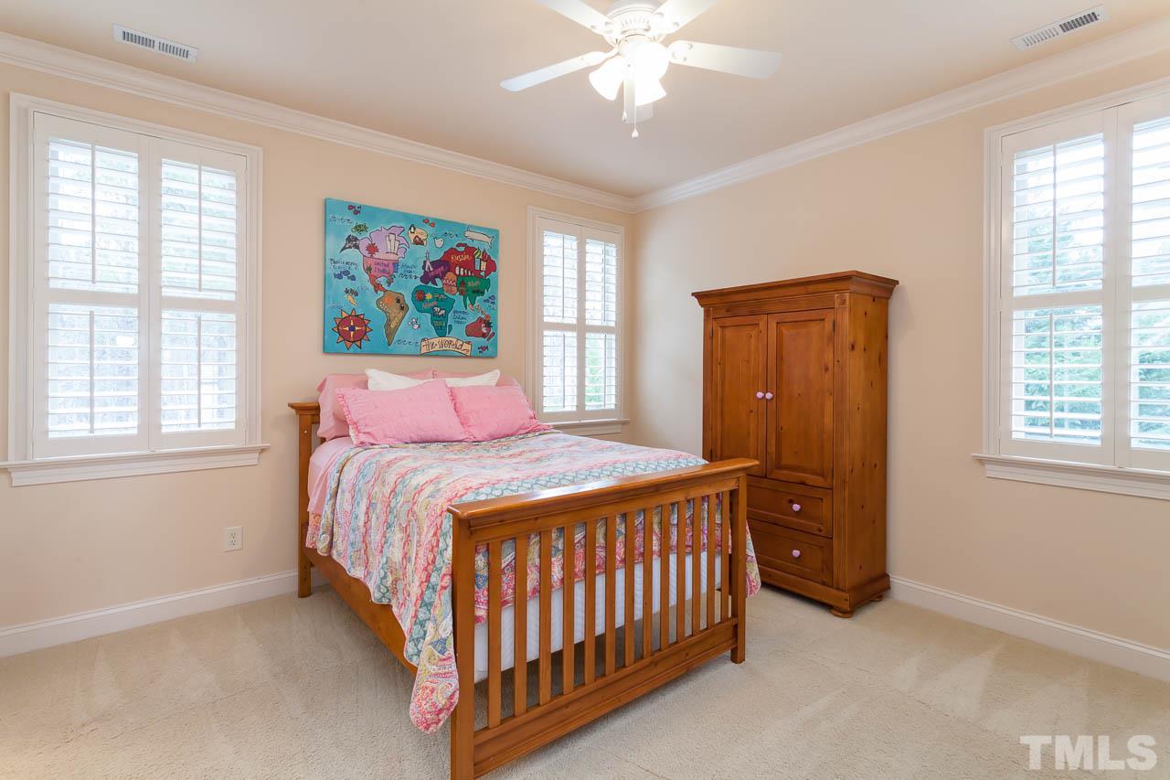 821 Keith Road Wake Forest, NC 27587 - Photo 17 of 25 This large bedroom enjoys its own private bath with a tub/shower combination. It also has a large walk in closet, ceiling fan, crown molding, and plantation shutters.