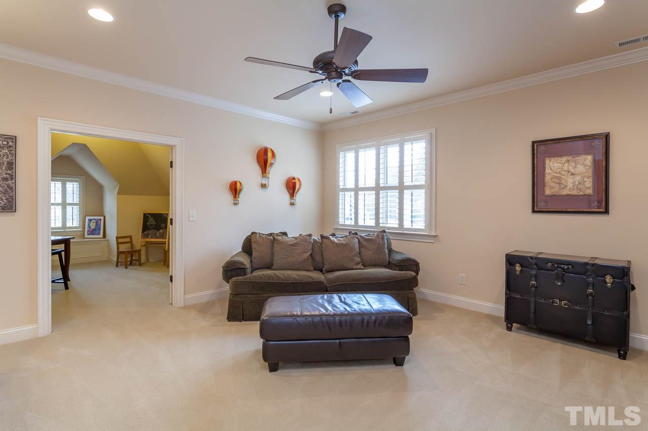 821 Keith Road Wake Forest, NC 27587 - Photo 20 of 25 The versatile 2nd floor bonus room is actual two adjoining rooms. The front bonus is currently used as a media room and the back bonus room has been a wonderful craft and hobby room. 2 large walk-in attics are off the bonus room