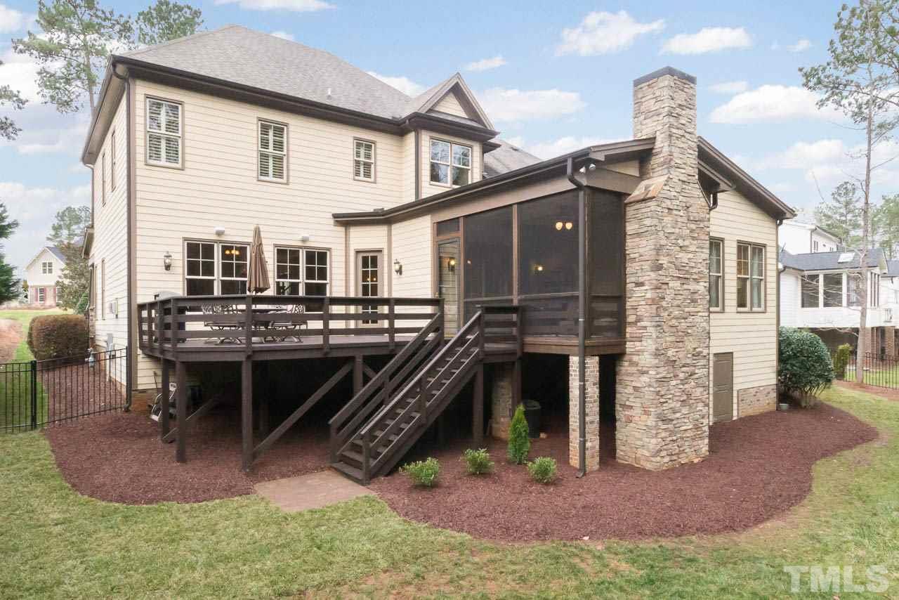821 Keith Road Wake Forest, NC 27587 - Photo 25 of 25 Notice the 2 story stone fireplace and the door to the walk in crawlspace.