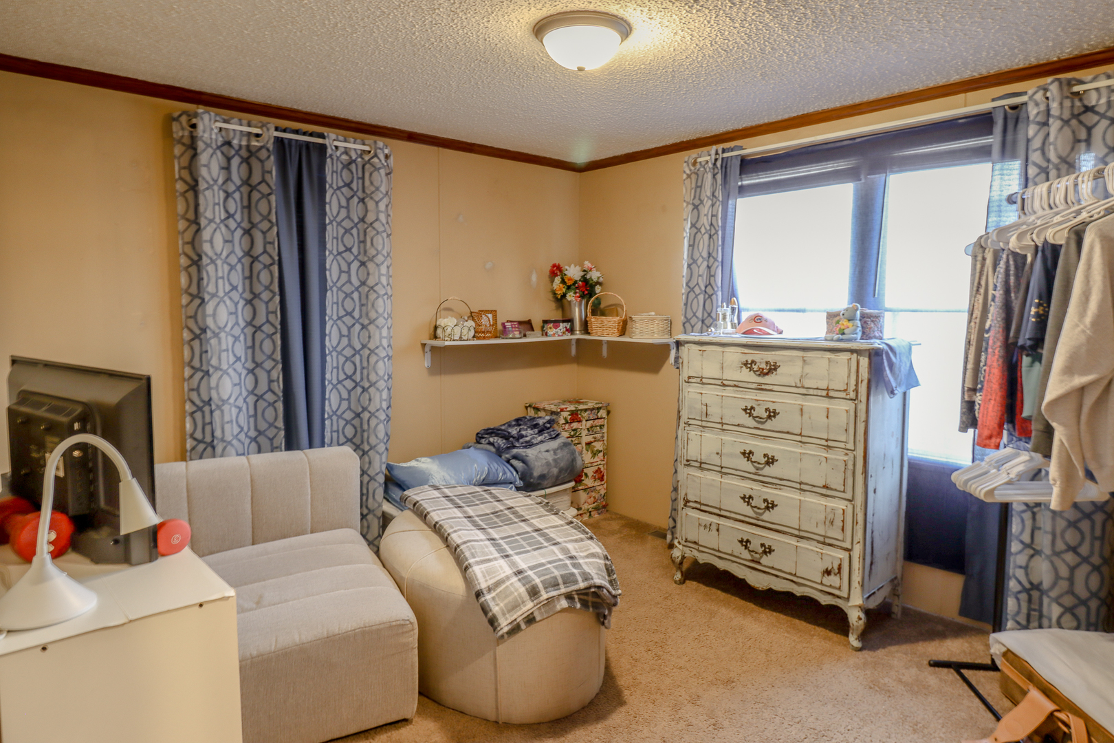 50 Cherry Lane Bourbonnais, IL 60914 - Photo 11 of 18 a living room with furniture and a flat screen tv