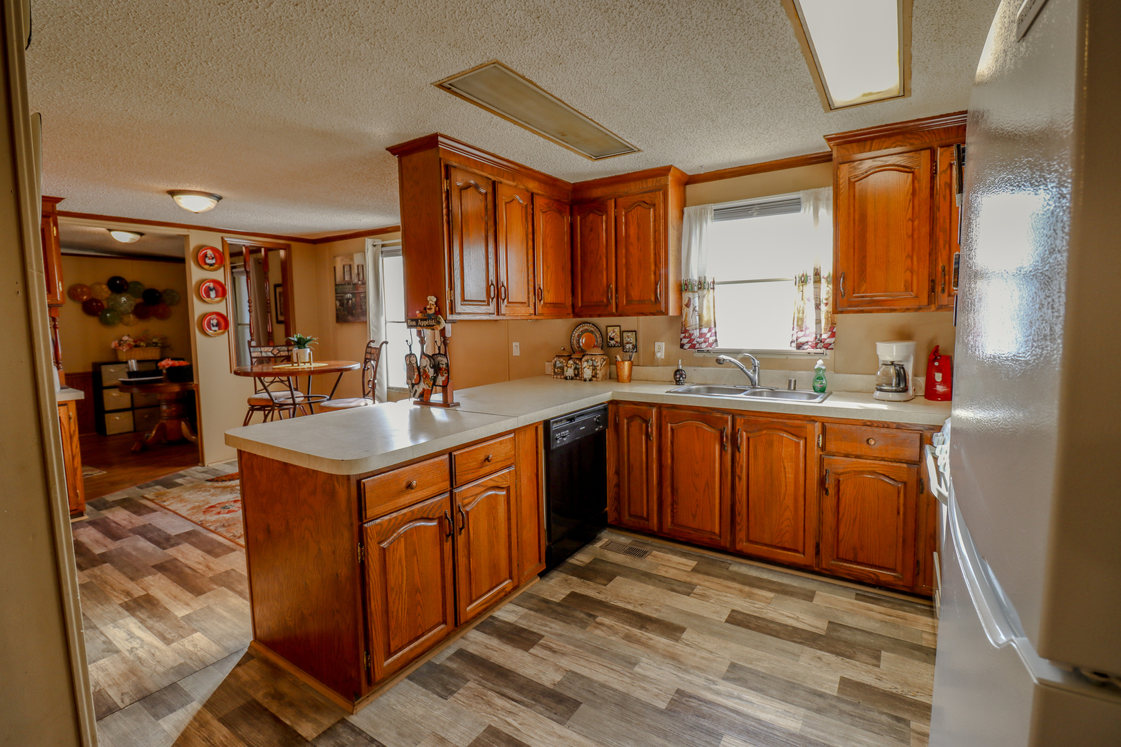 50 Cherry Lane Bourbonnais, IL 60914 - Photo 3 of 18 a kitchen with a sink stove and cabinets