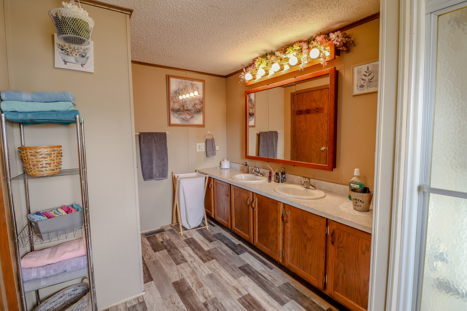 50 Cherry Lane Bourbonnais, IL 60914 - Photo 9 of 18 a bathroom with a sink a mirror and a shower