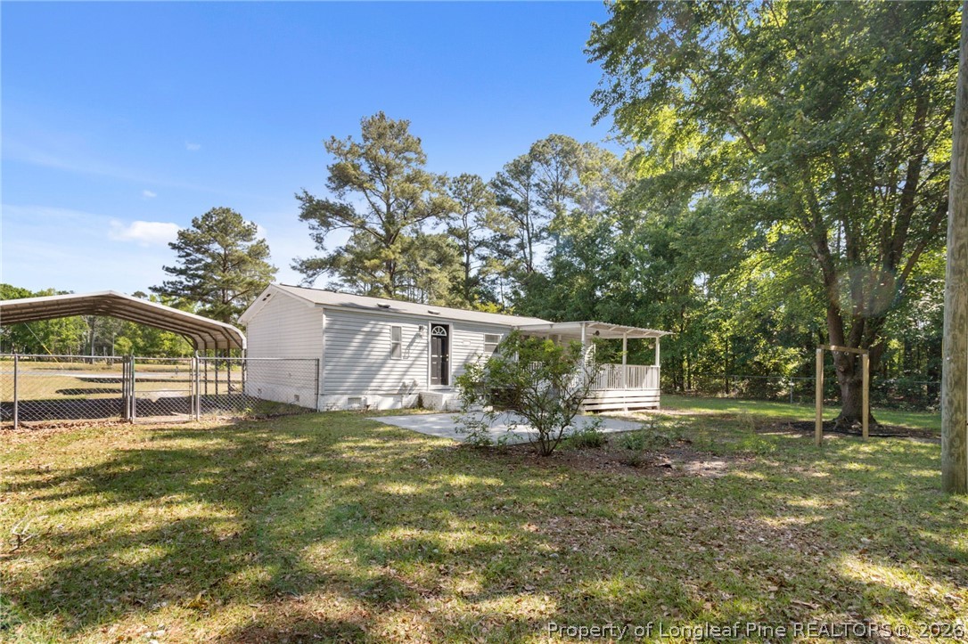6568 Sandy Creek Road Stedman, NC 28391 - Photo 27 of 34 a view of a backyard