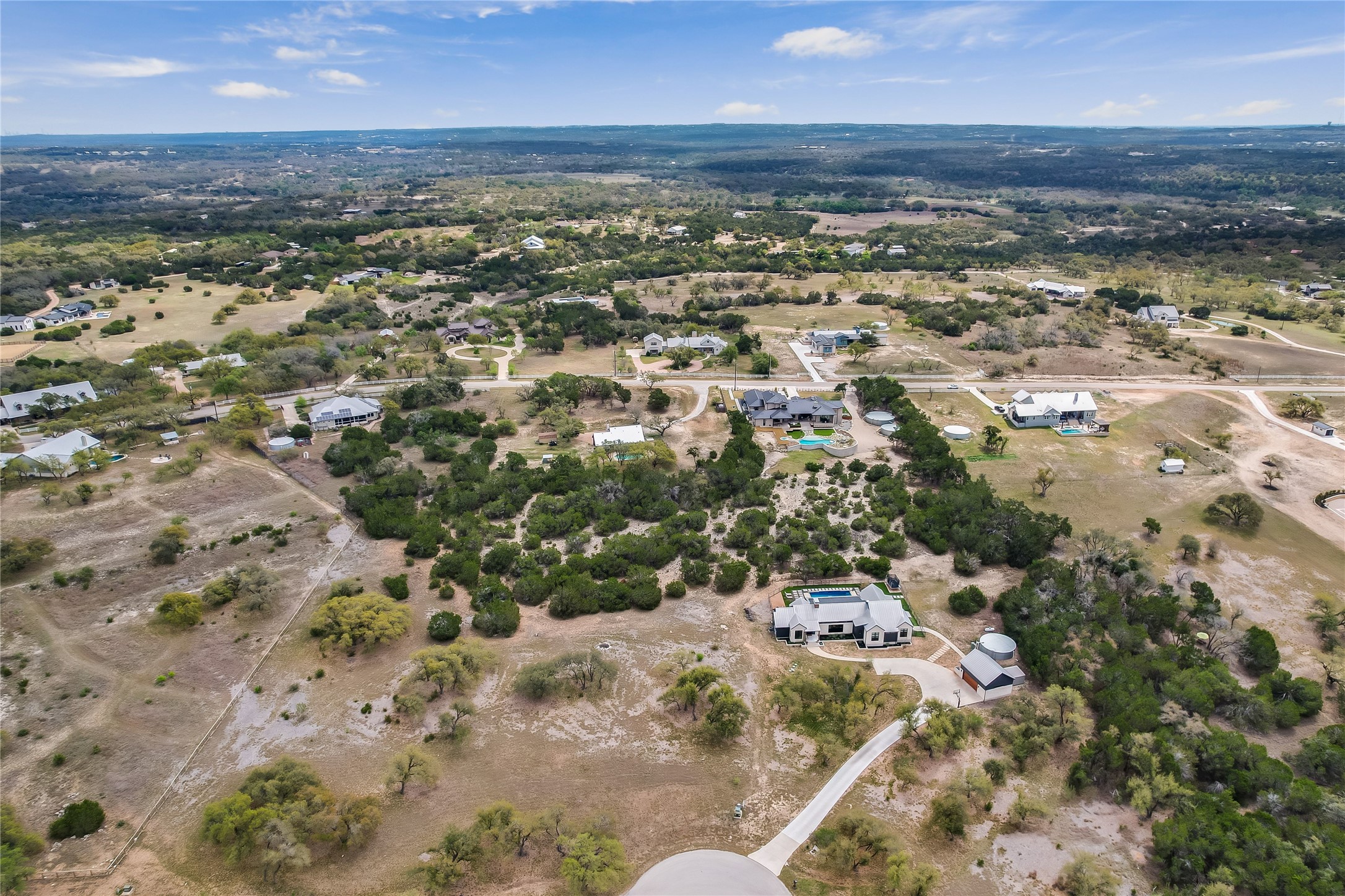285 Calvary Cove Dripping Springs, TX 78620 - Photo 2 of 17 an aerial view of residential houses with outdoor space
