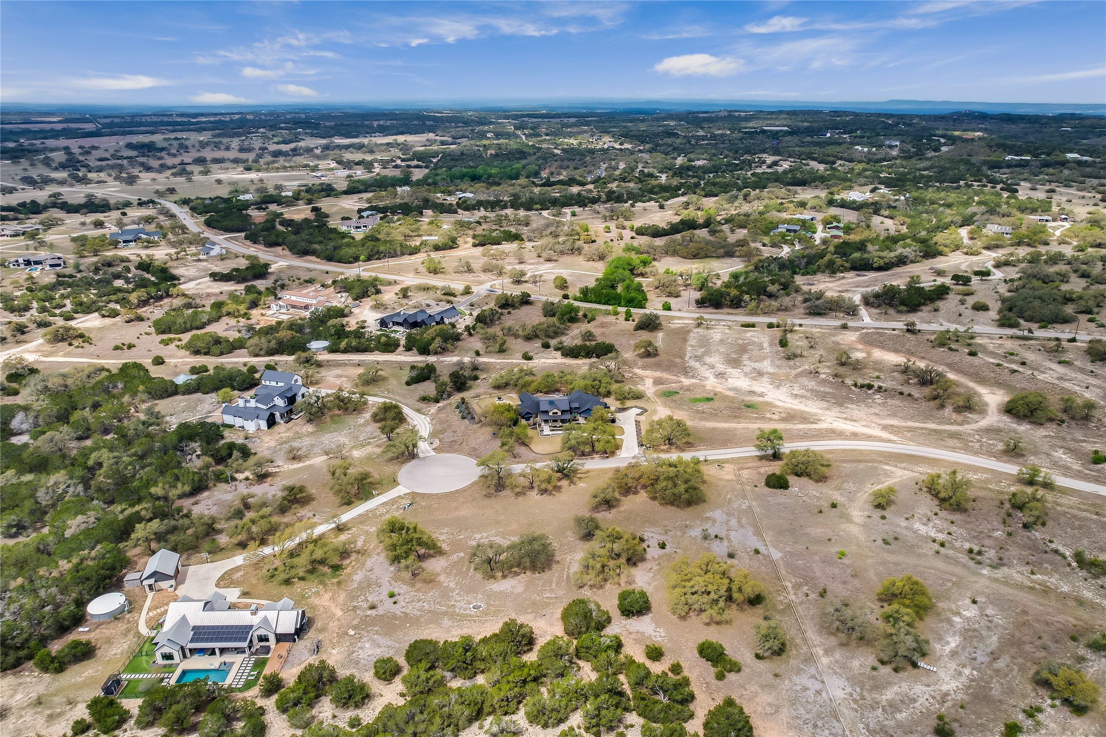 285 Calvary Cove Dripping Springs, TX 78620 - Photo 4 of 17 an aerial view of residential building with parking space