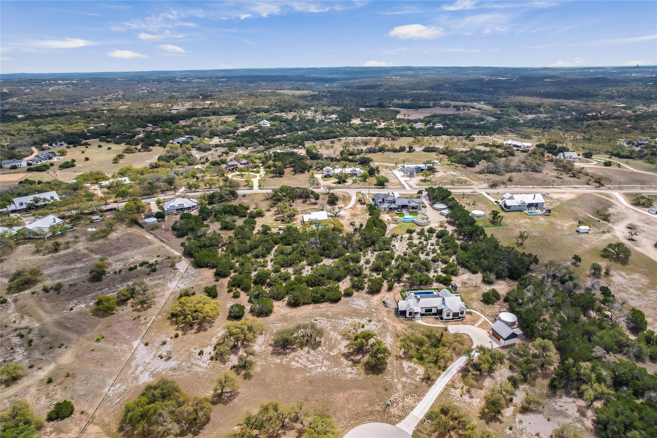 285 Calvary Cove Dripping Springs, TX 78620 - Photo 8 of 17 an aerial view of residential houses with outdoor space