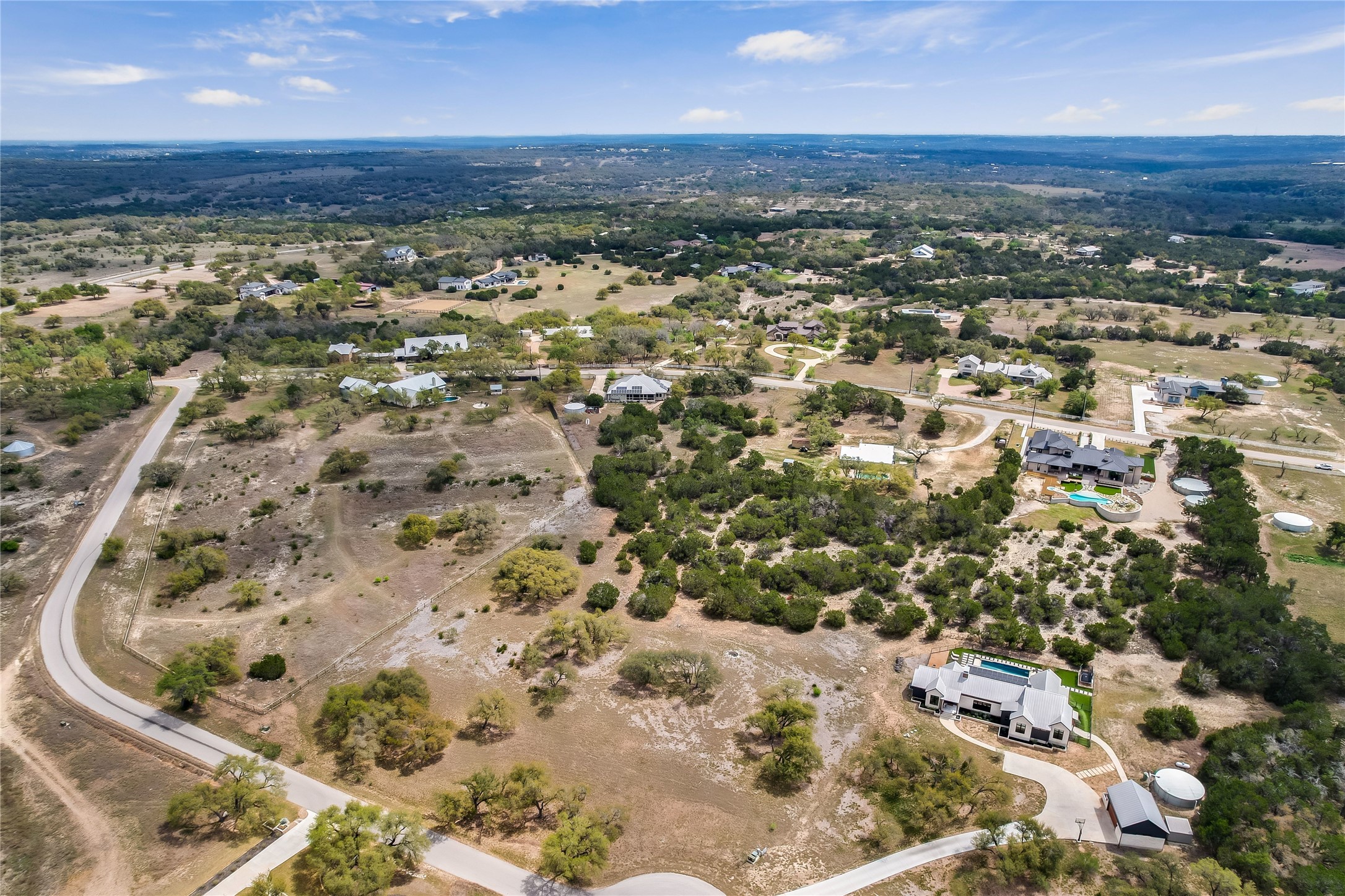 285 Calvary Cove Dripping Springs, TX 78620 - Photo 9 of 17 an aerial view of residential houses with outdoor space