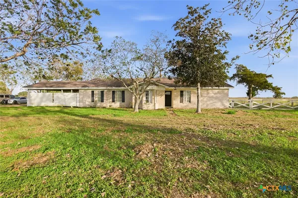 a house view with swimming pool in front of it