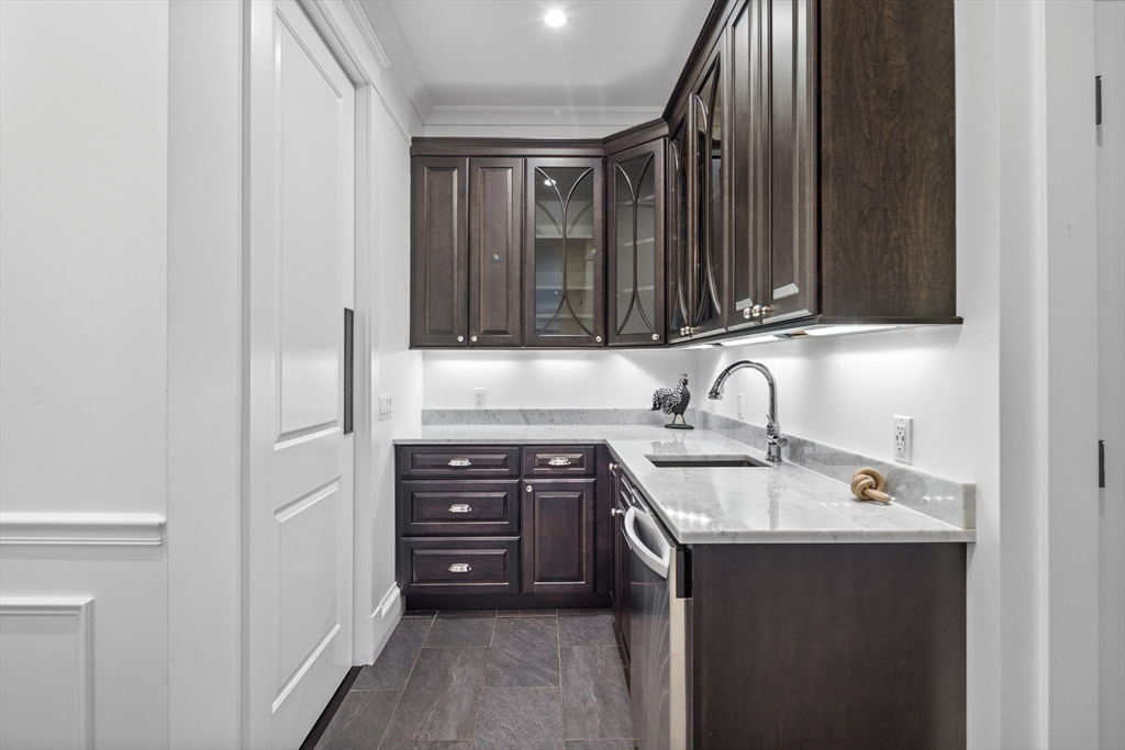 75 Goddard Avenue Brookline, MA 02445 - Photo 12 of 27 a kitchen with a sink and cabinets