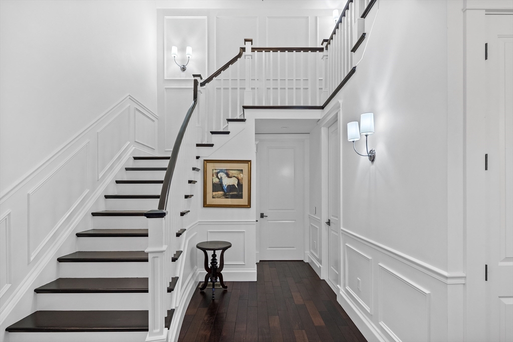 75 Goddard Avenue Brookline, MA 02445 - Photo 13 of 27 a view of entryway with wooden floor and stairs