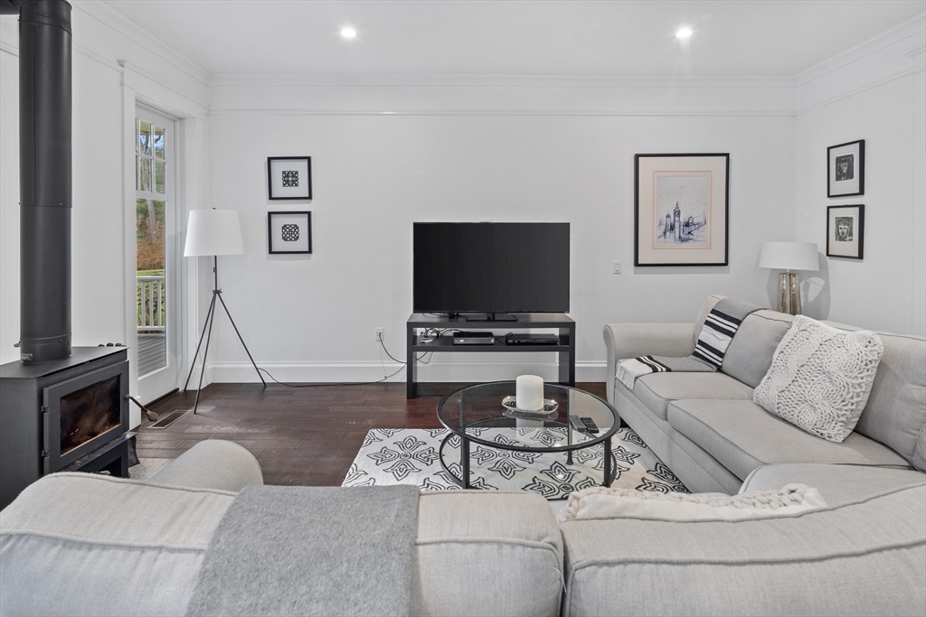 75 Goddard Avenue Brookline, MA 02445 - Photo 14 of 27 a living room with furniture and a flat screen tv
