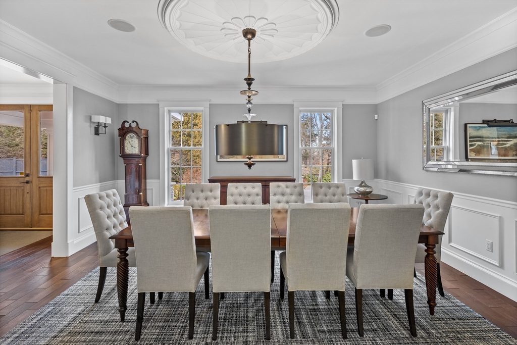 75 Goddard Avenue Brookline, MA 02445 - Photo 15 of 27 a view of a dining room with furniture window and wooden floor