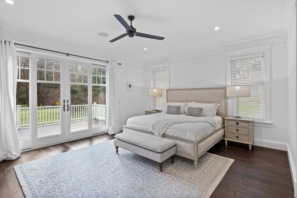75 Goddard Avenue Brookline, MA 02445 - Photo 16 of 27 a spacious bedroom with a bed painting and wooden floor