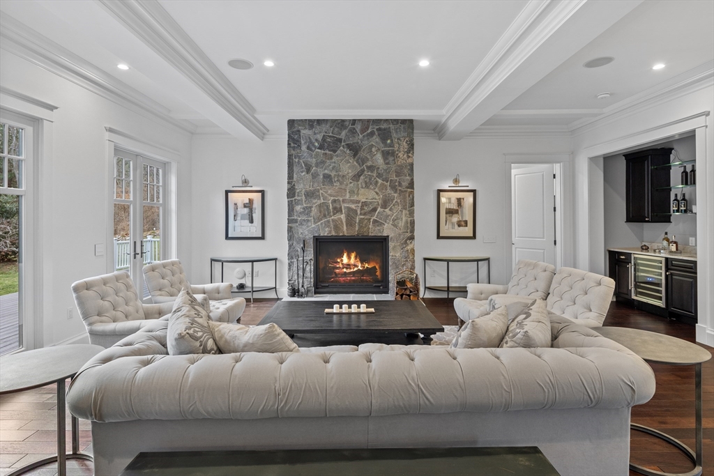 75 Goddard Avenue Brookline, MA 02445 - Photo 2 of 27 a living room with furniture and a fireplace