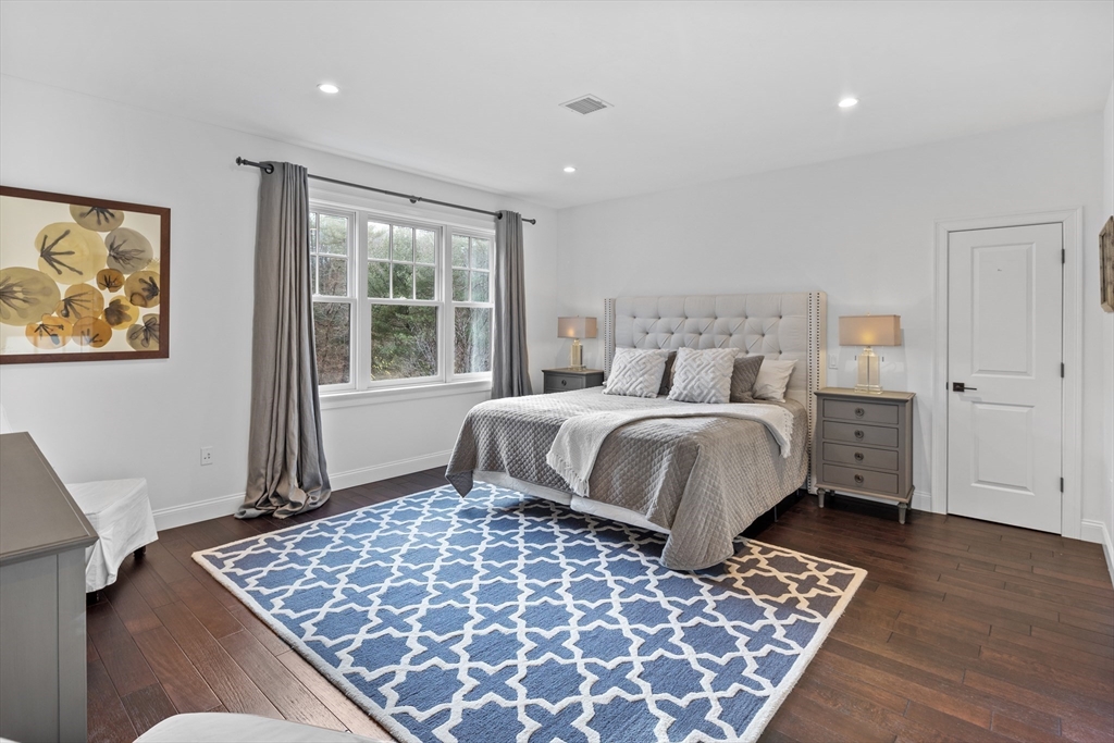 75 Goddard Avenue Brookline, MA 02445 - Photo 21 of 27 a bedroom with a large bed and a window