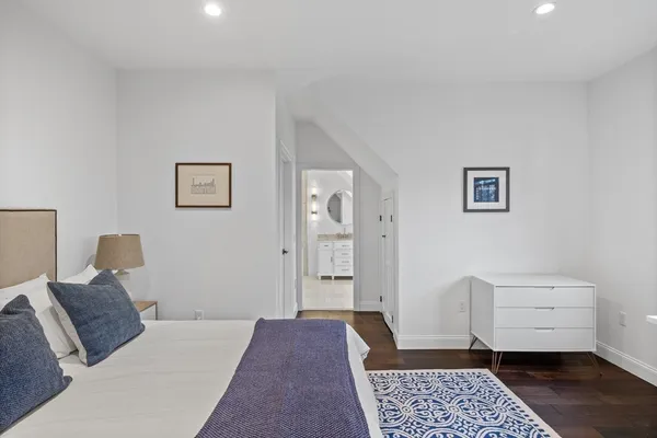 a bedroom with furniture and window
