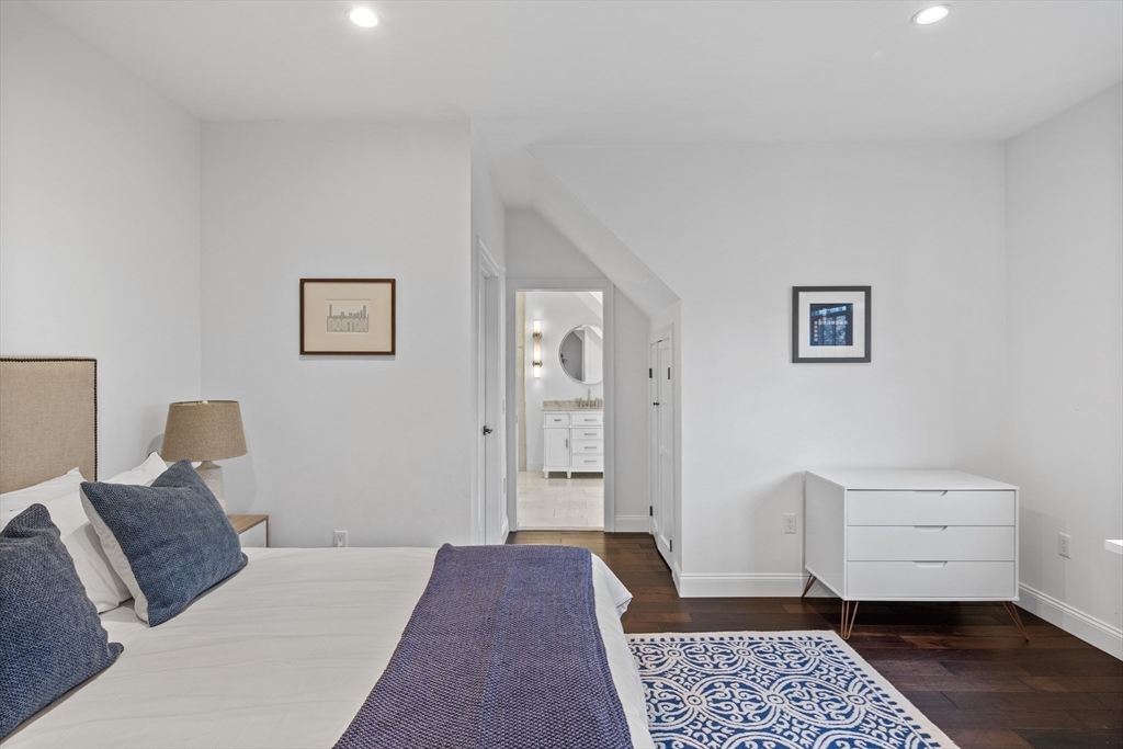 75 Goddard Avenue Brookline, MA 02445 - Photo 23 of 27 a bedroom with furniture and window