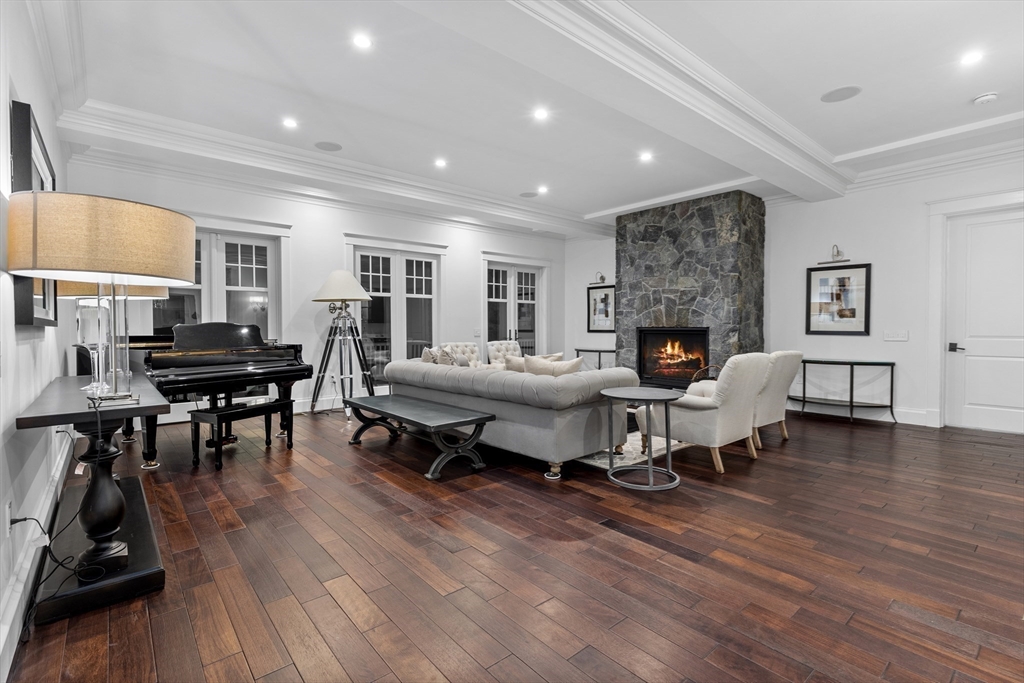 75 Goddard Avenue Brookline, MA 02445 - Photo 3 of 27 a living room with furniture and a fireplace