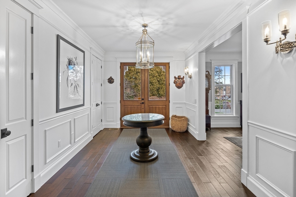 75 Goddard Avenue Brookline, MA 02445 - Photo 5 of 27 a living room with furniture and a chandelier