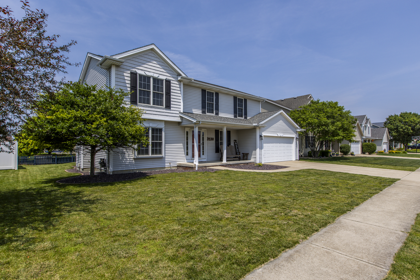 3230 Turquois Way Normal, IL 61761 - Photo 2 of 28 a front view of a house with a garden