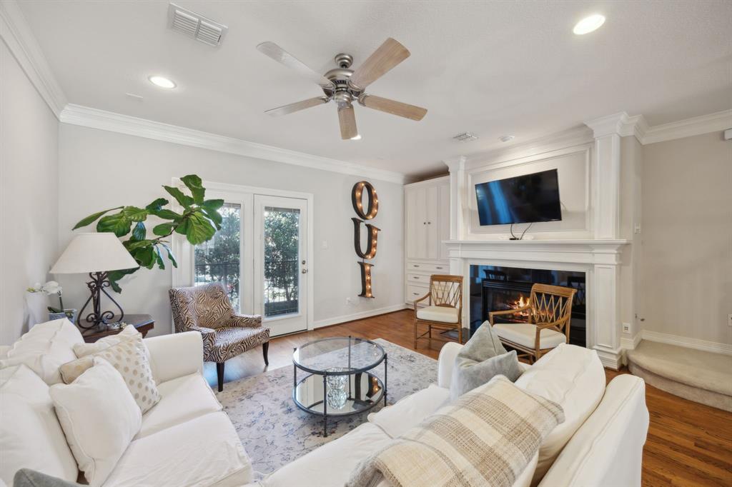 3461 Howell Street Dallas, TX 75204 - Photo 1 of 1 a living room with furniture a fireplace and a flat screen tv
