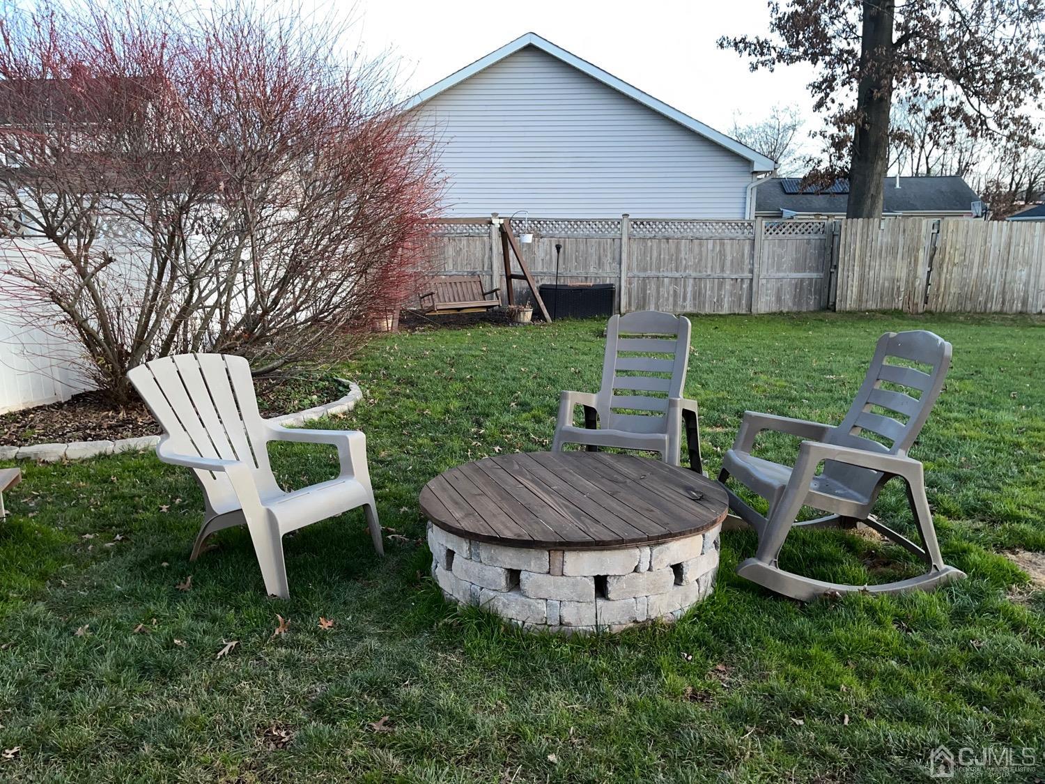 34 Dalton Place Edison, NJ 08817 - Photo 12 of 20 a view of a chair and table in backyard of the house
