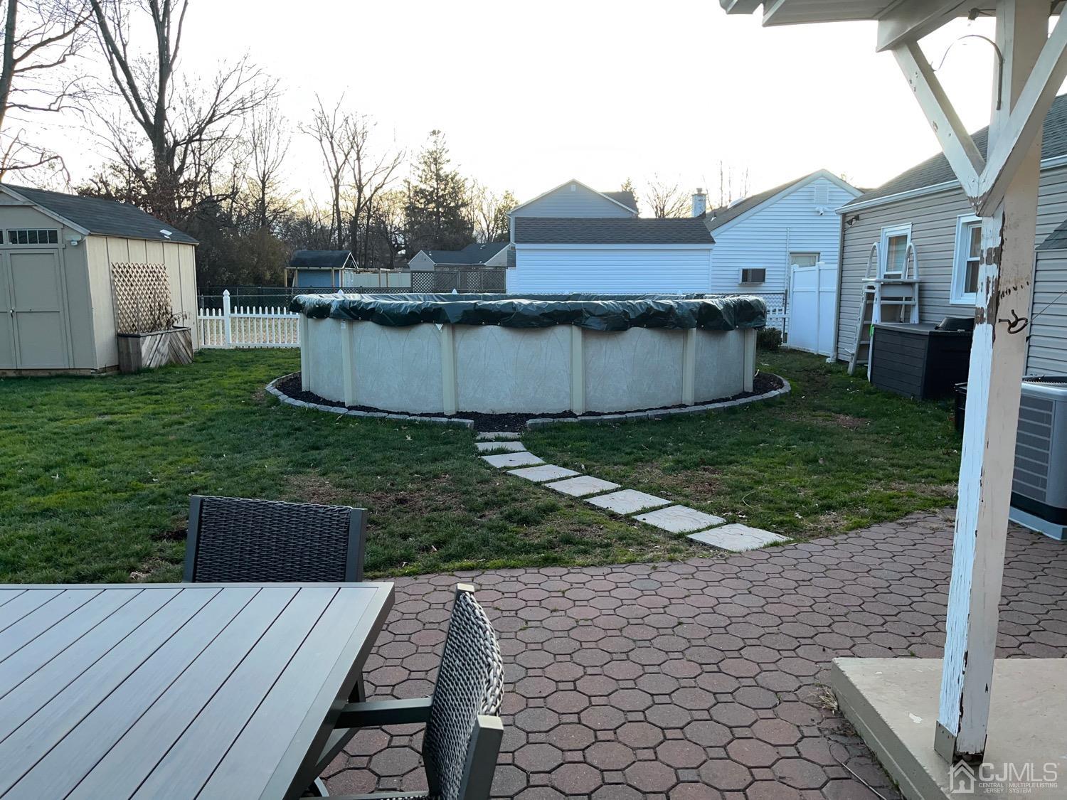 34 Dalton Place Edison, NJ 08817 - Photo 14 of 20 a view of a house with backyard and a tree